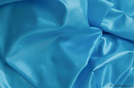 Close detail of glossy silk fabric catching the light